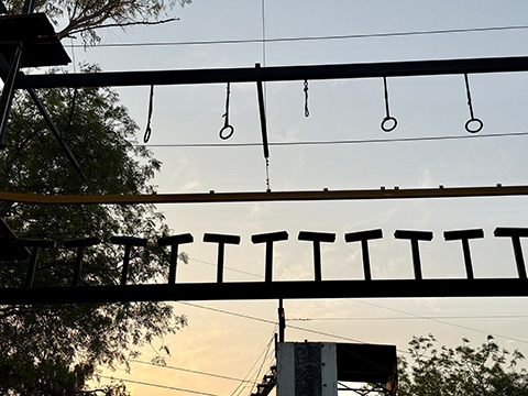 Evening view of obstacle course at adventure park at Roadies Rostel ARC Resort near Ahmedabad