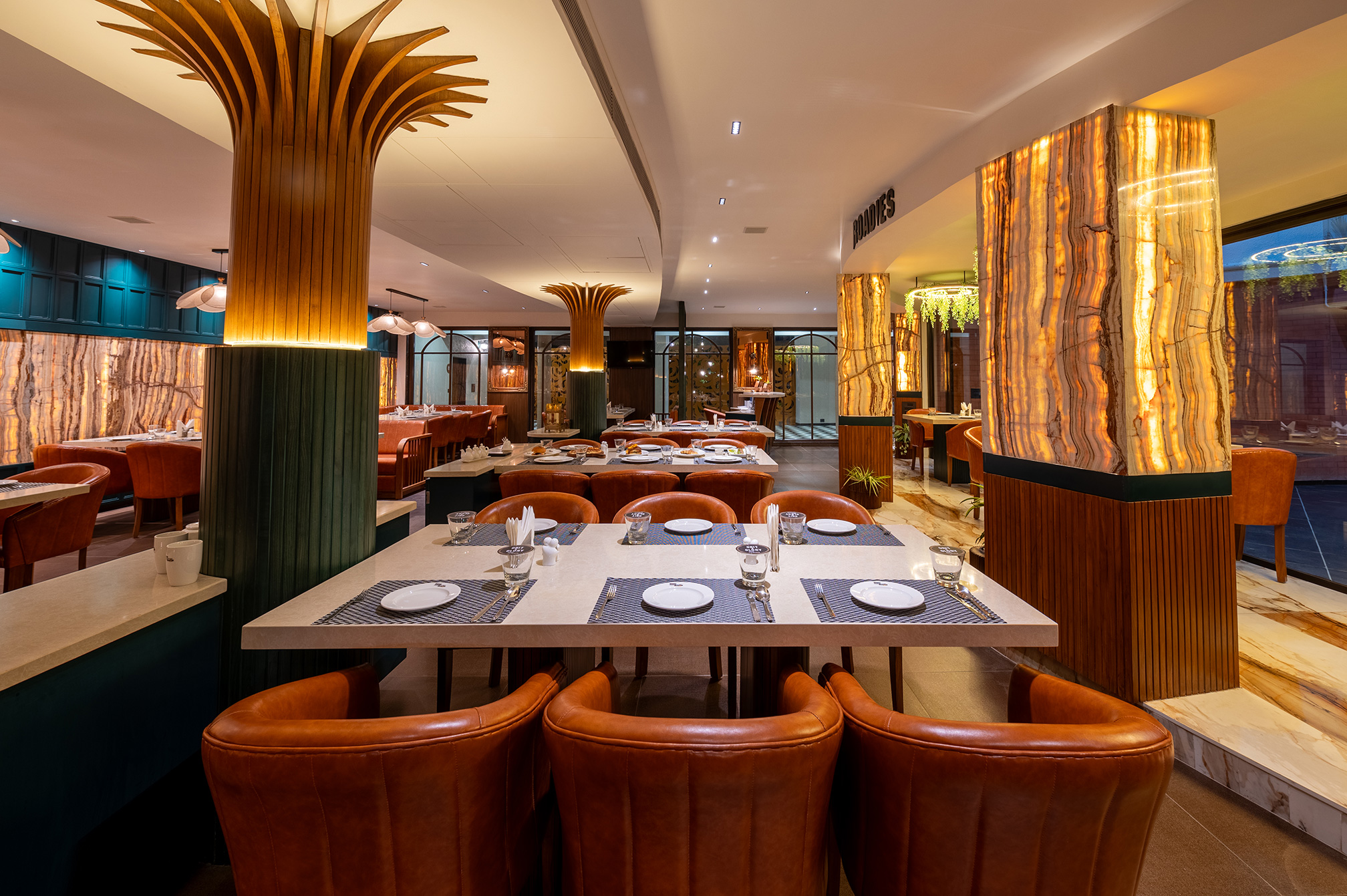 Chic dining table seating at Samyati restaurant, perfect for a relaxed meal at one of the best resorts near Ahmedabad.