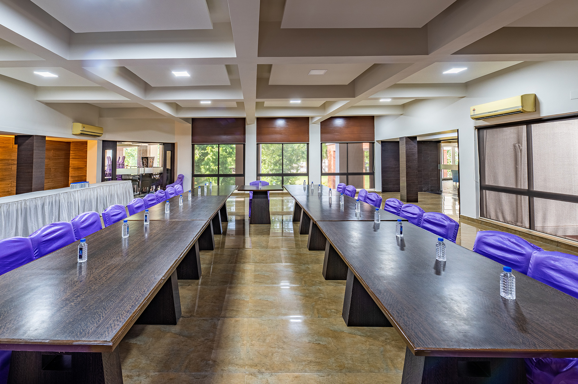 Spacious banquet hall interior at Samyati, the ideal event and dining venue at a luxury resort near Ahmedabad.