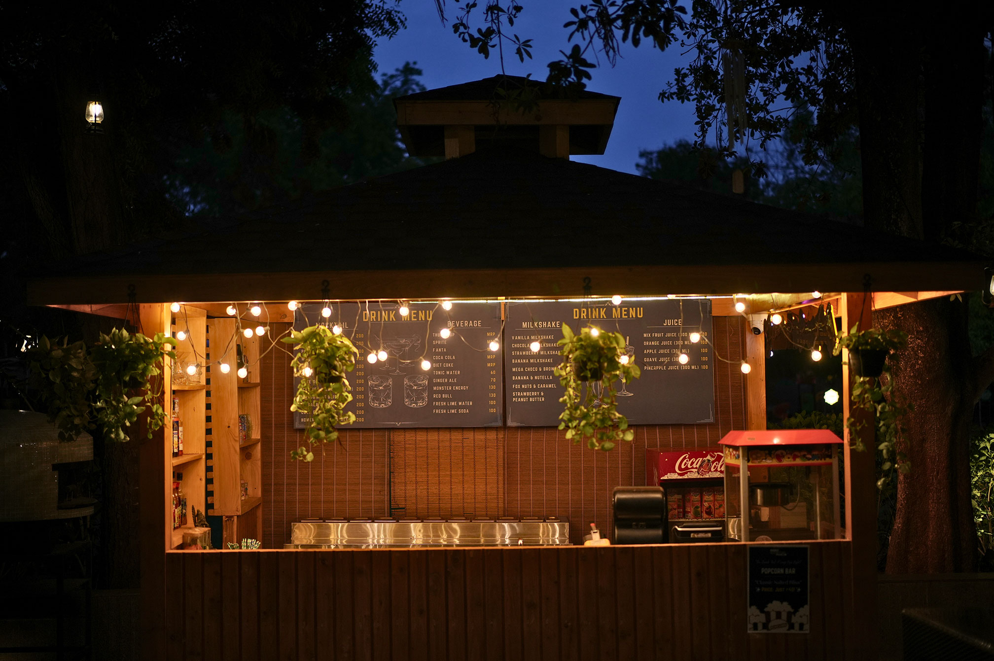 Comfortable outdoor bar seating at The Nest mocktail bar, blending nature and leisure at one day picnic resort near Ahmedabad.