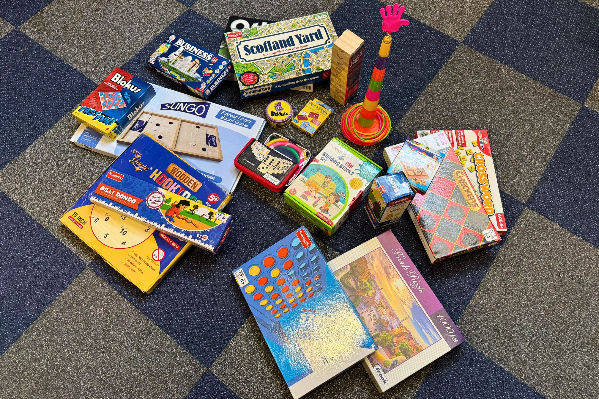 Collection of board games in the kids indoor play area at Roadies Rostel ARC Resort, kid friendly one day picnic resort near Ahmedabad.
