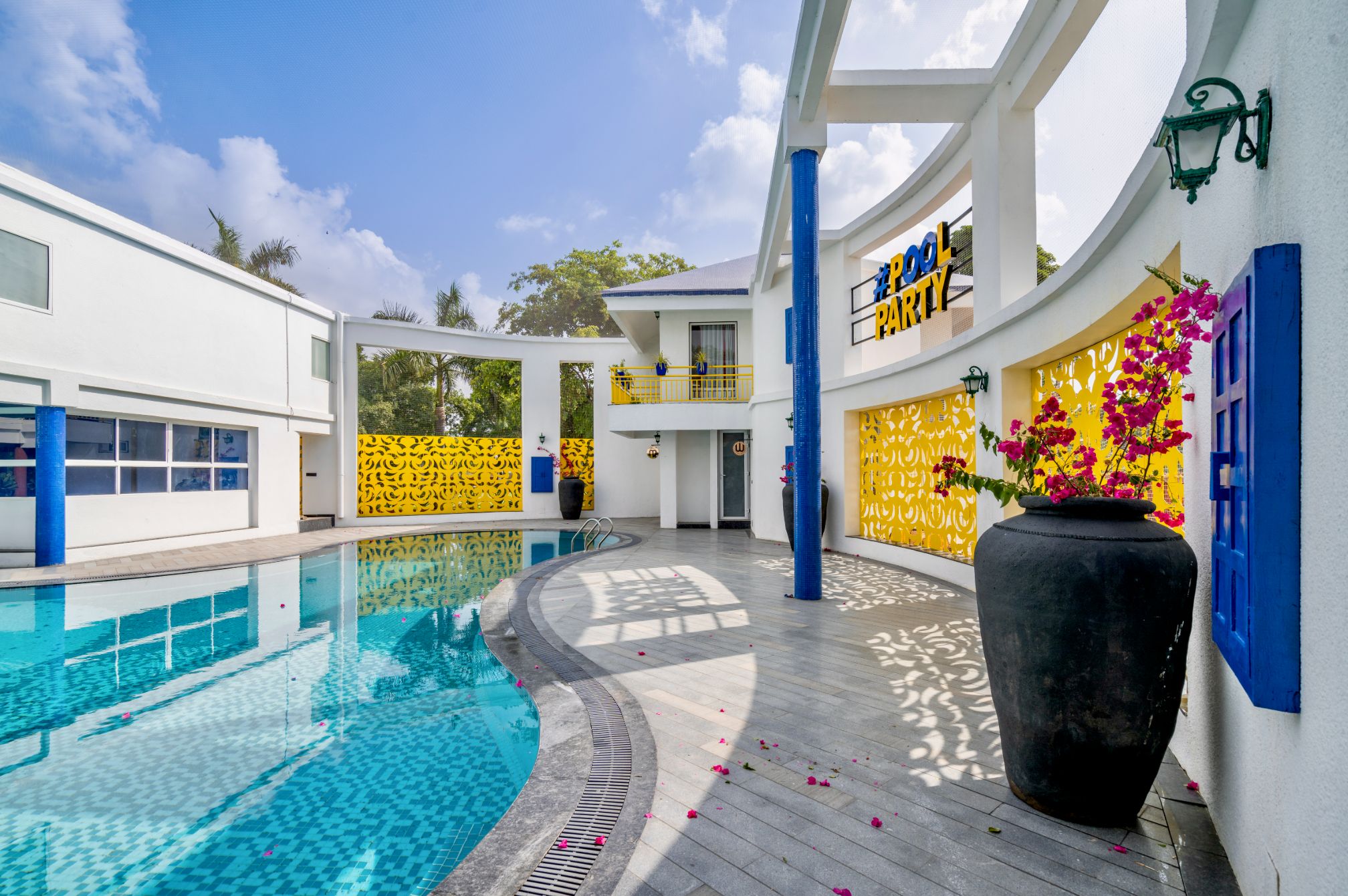 Grand poolside entrance at Roadies Rostel, ideal for one day outing near Ahmedabad