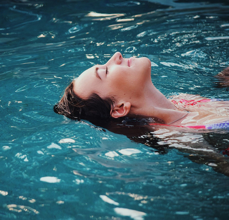 Relaxing swim experience at the pool in Roadies Rostel, a top one day picnic resort near Ahmedabad