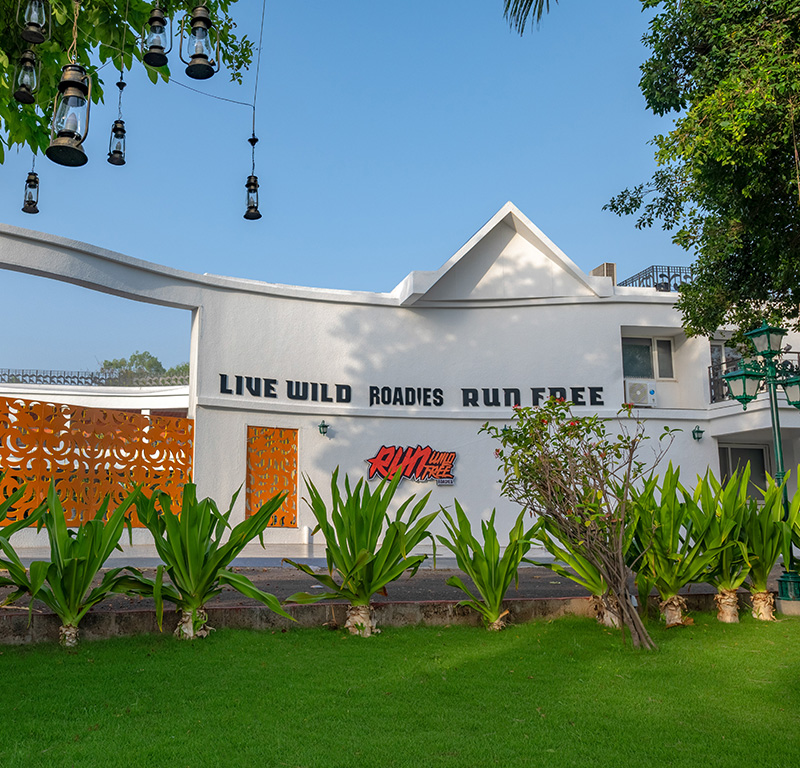 Roadies Rostel ARC Resort entrance with 'Live Wild' signage, ideal for one day outing near Ahmedabad