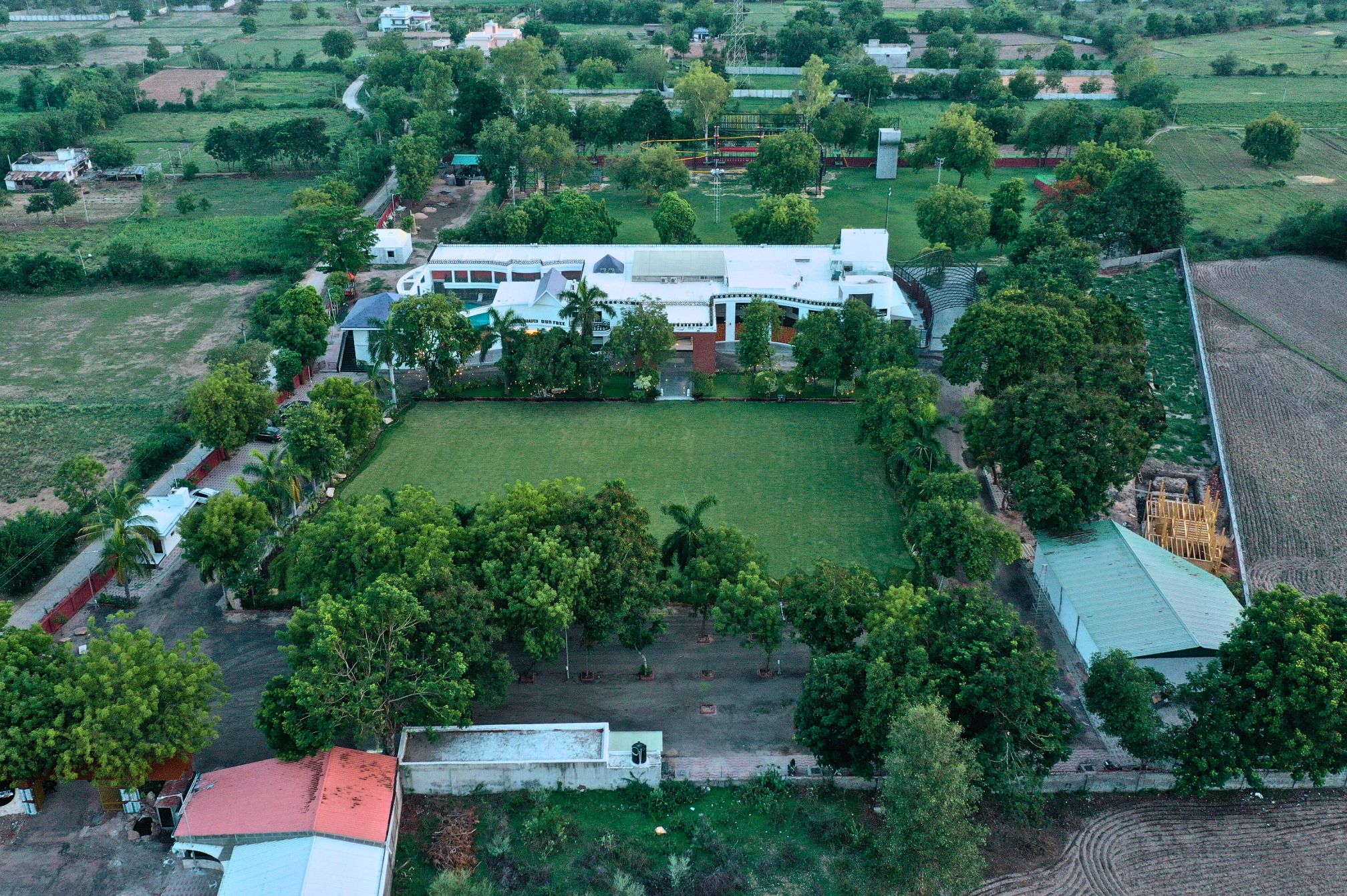 Aerial shot of Roadies Rostel’s lush green campus, ideal for a peaceful one day outing near Ahmedabad