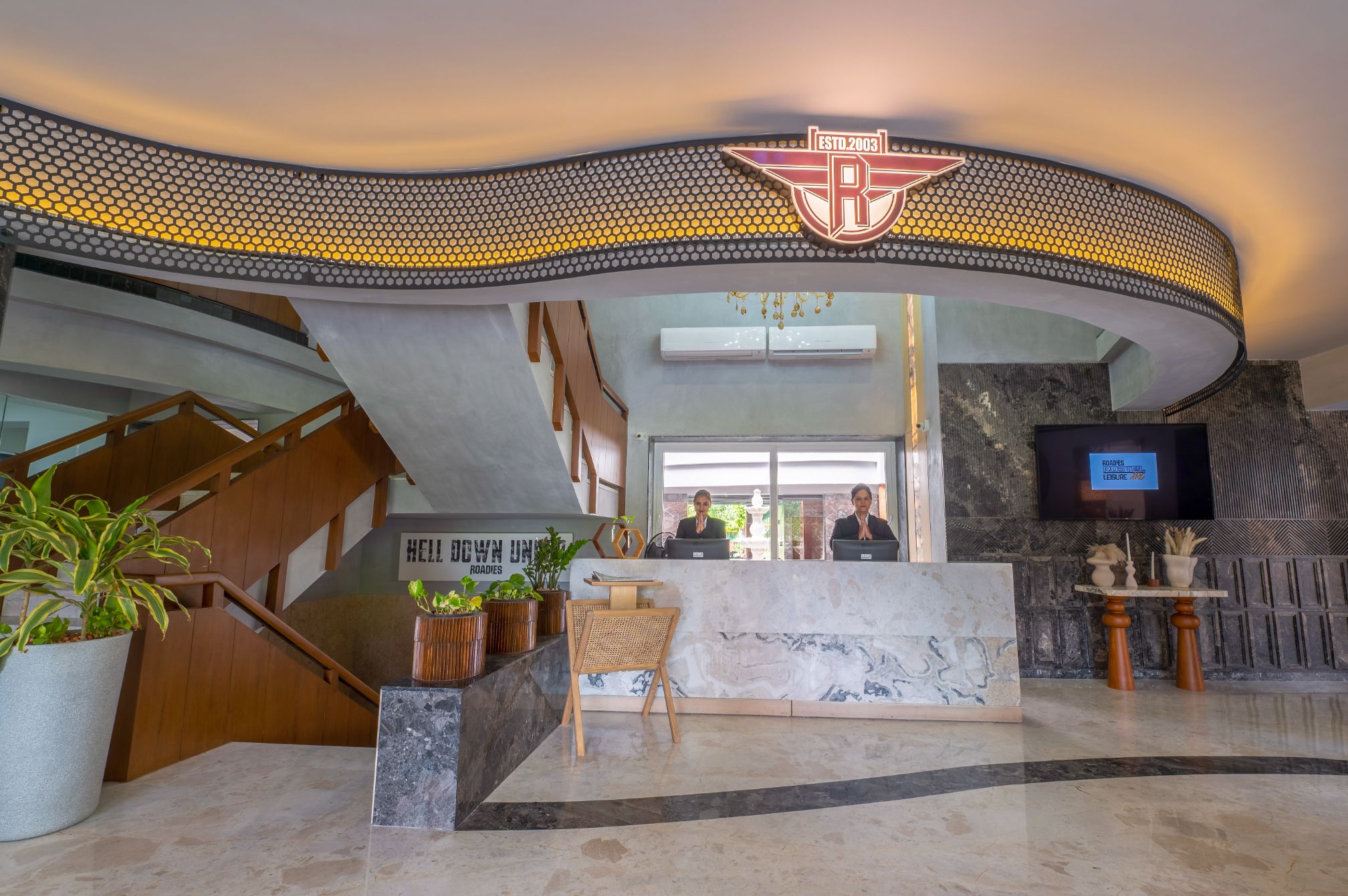 Reception lobby at Roadies Rostel ARC Resort offering a warm welcome for one day picnic guests near Ahmedabad
