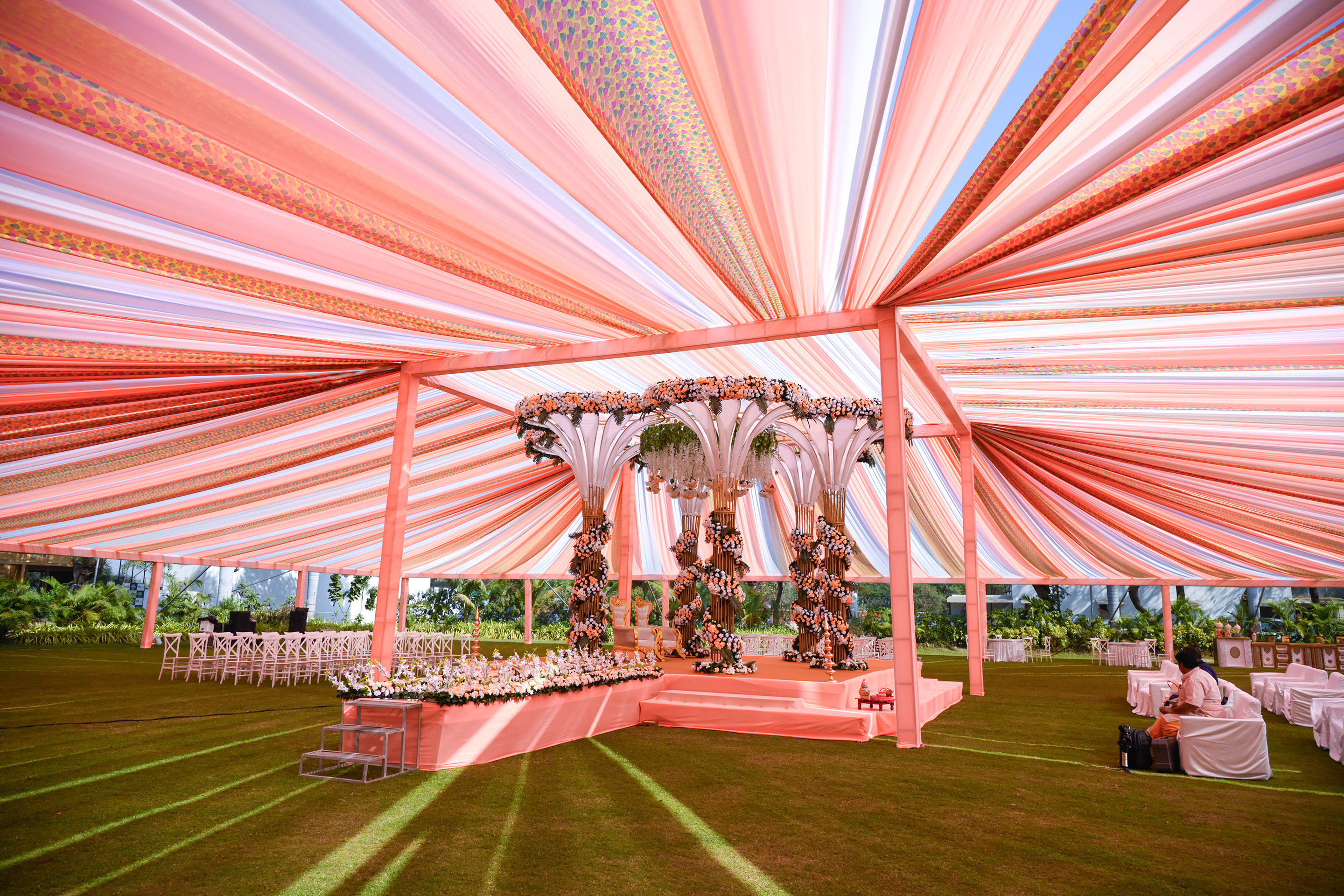 Mandap setup adorned with fresh flowers and traditional elements at one of the best wedding venues near Ahmedabad.