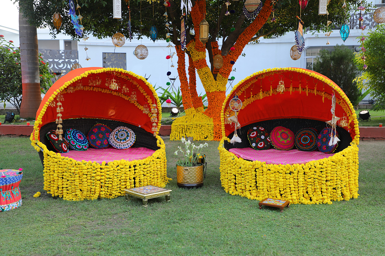 Haldi ceremony setup with colorful drapes and floral decor at Roadies Rostel ARC Resort, ideal for vibrant wedding functions near Ahmedabad.