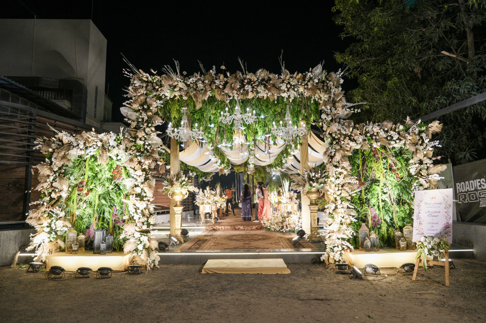 Floral-decorated entrance gate for weddings at Roadies Rostel ARC Resort, ideal for royal welcome setups.