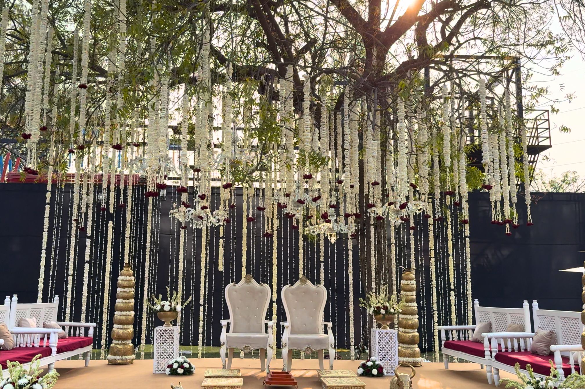 Beautifully decorated wedding stage with floral backdrop at Roadies Rostel ARC Resort Ahmedabad, perfect for grand celebrations.