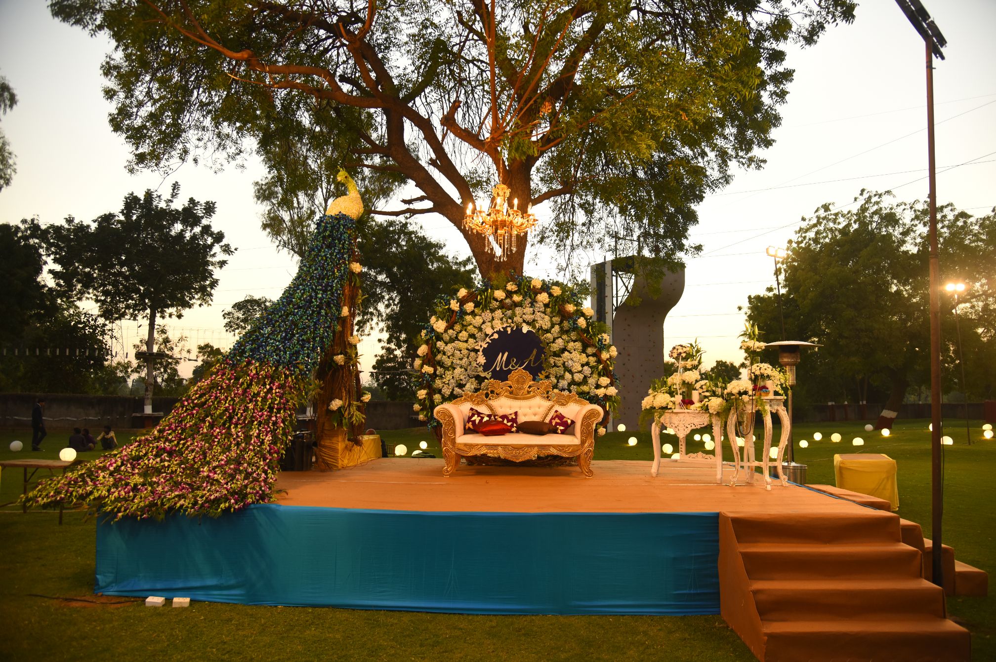 Elegant stage setup with lights and fabric decor at one of the best wedding venues near Ahmedabad.