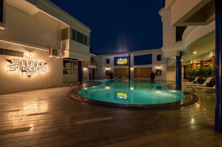 Casa poolside venue beautifully decorated for a wedding ceremony at Roadies Rostel ARC Resort, blending elegance with water-side charm.
